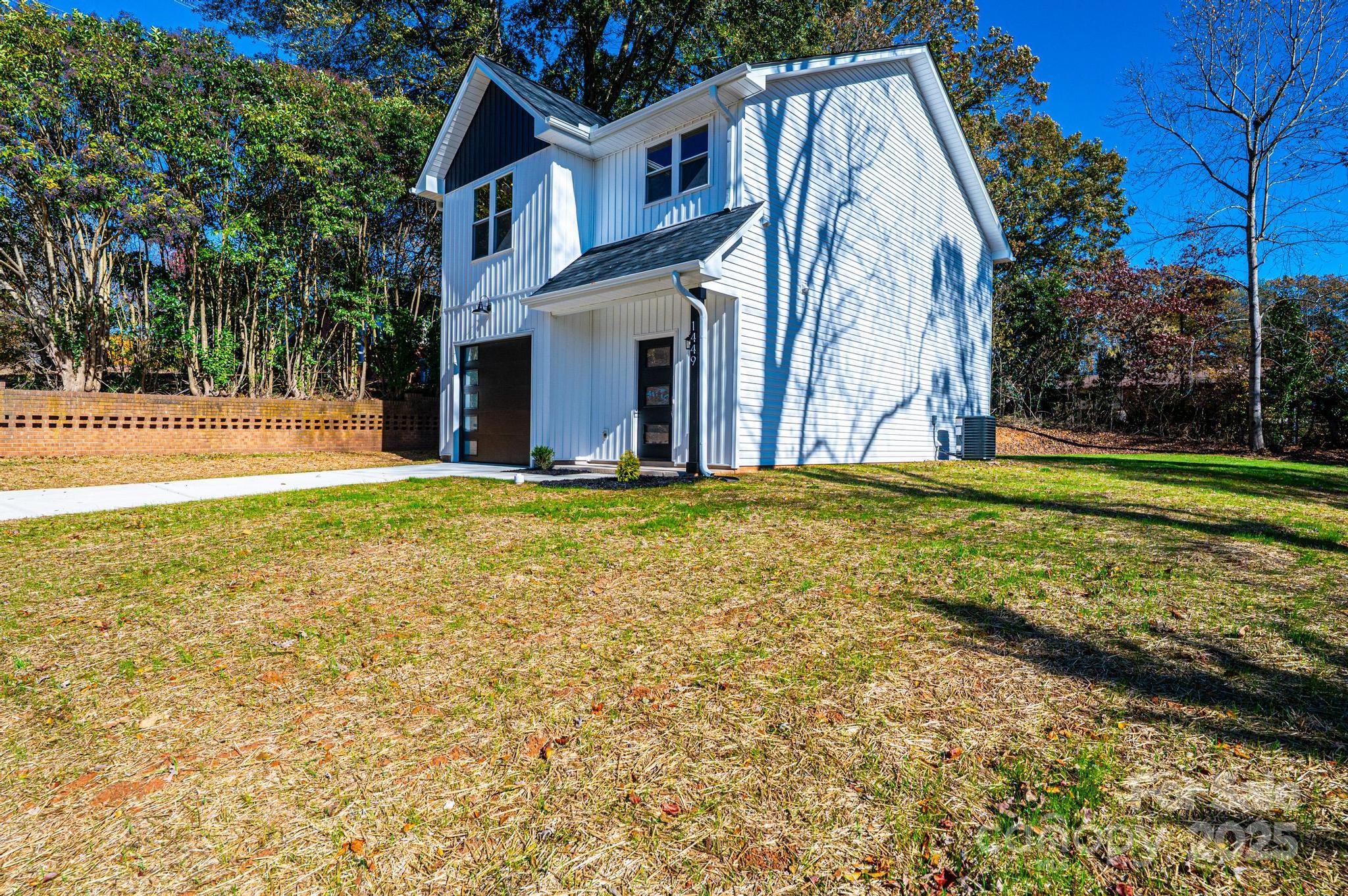 1449 4th Street Southwest Hickory, NC 28602 - Photo 16 of 19 a view of a house with a yard