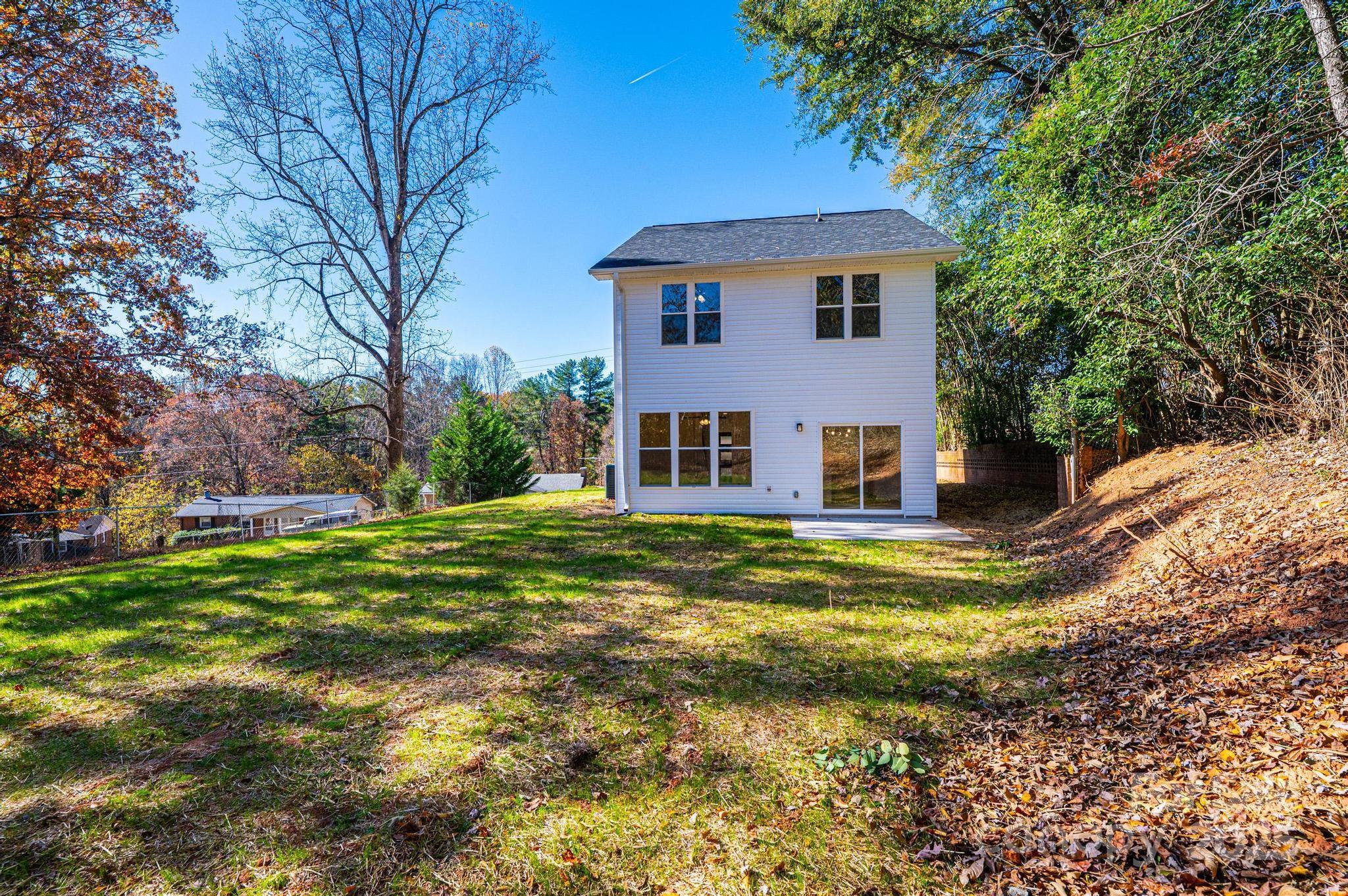 1449 4th Street Southwest Hickory, NC 28602 - Photo 3 of 19 a view of a house with a yard