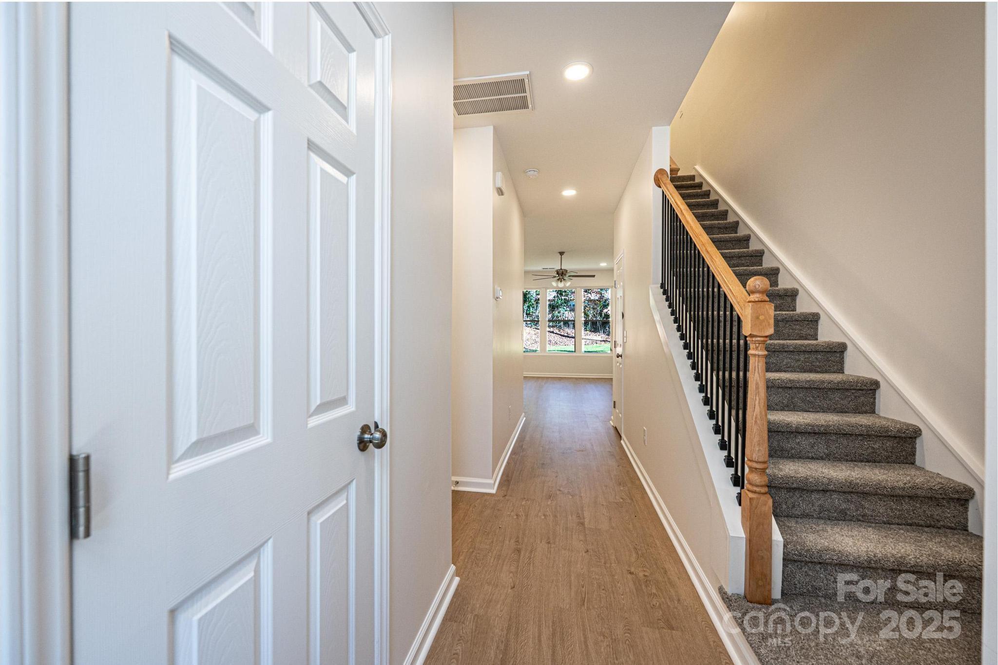 1449 4th Street Southwest Hickory, NC 28602 - Photo 7 of 19 a view of a hallway with wooden floor and entryway
