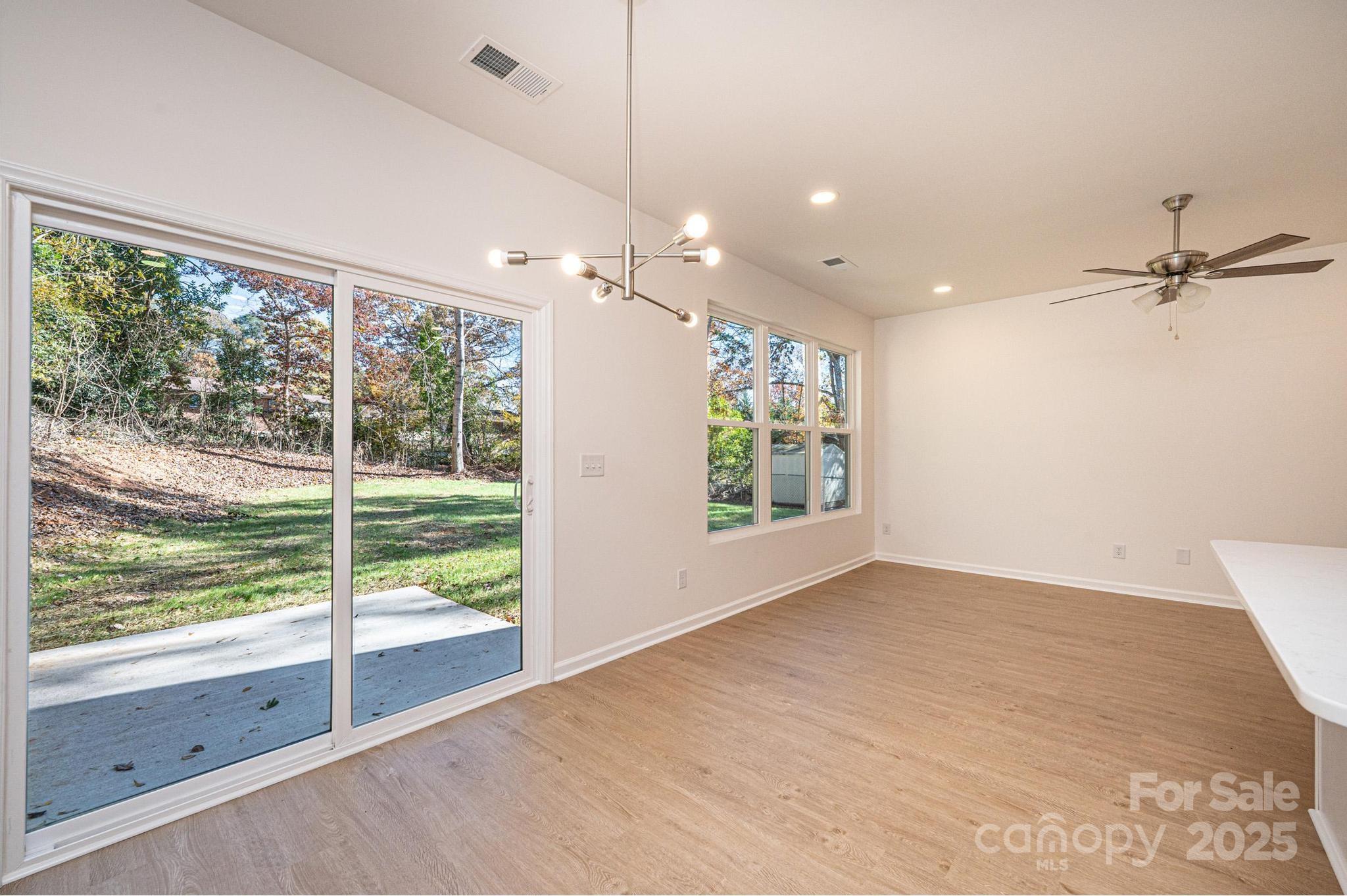 1449 4th Street Southwest Hickory, NC 28602 - Photo 10 of 19 a view of a livingroom with a ceiling fan and window