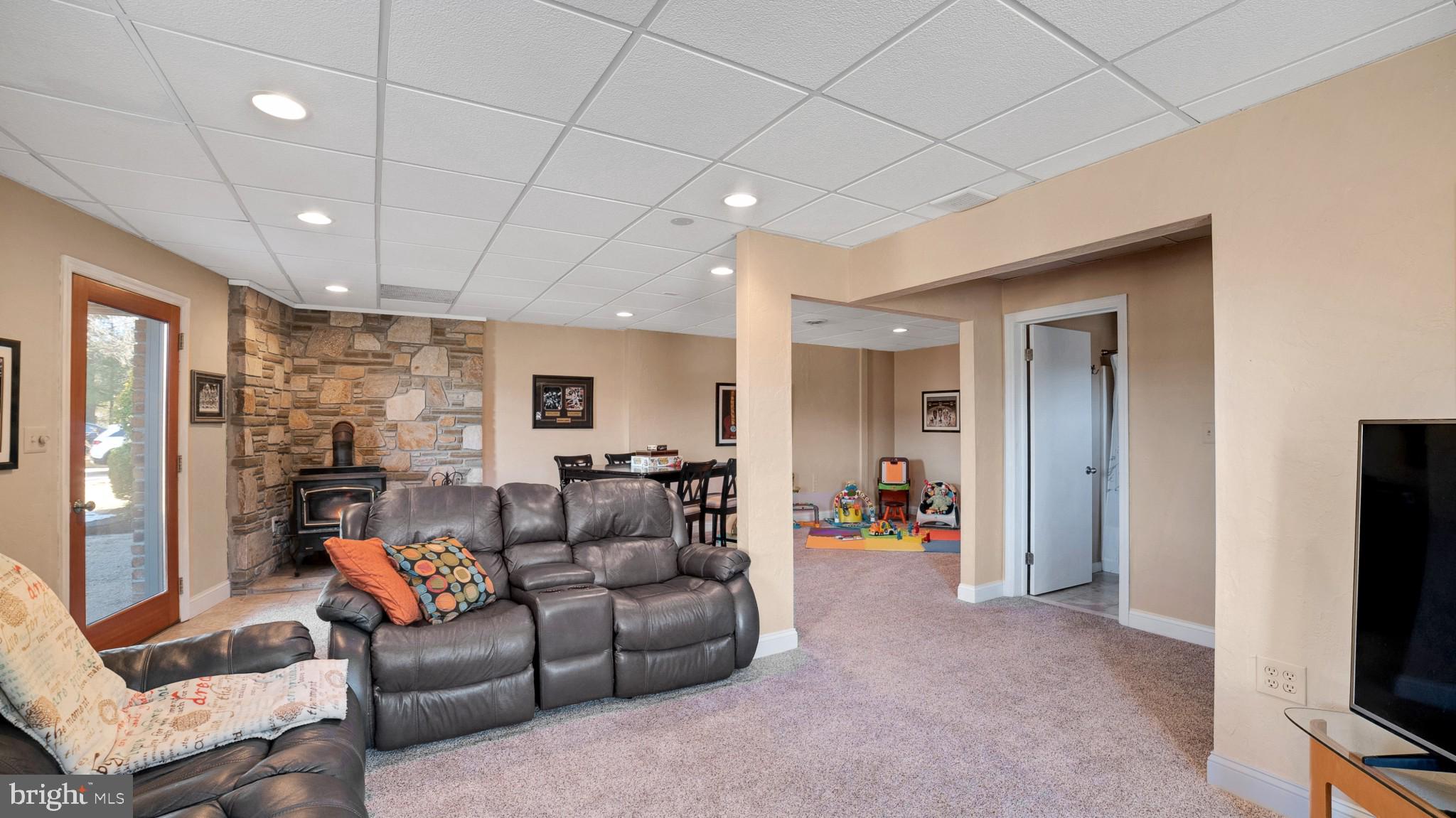 4757 Buffalo Road Mount Airy, MD 21771 - Photo 14 of 50 a living room with furniture a flat screen tv and a large window