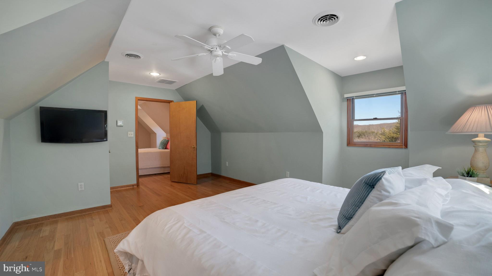 4757 Buffalo Road Mount Airy, MD 21771 - Photo 22 of 50 a bedroom with a bed and a flat screen tv