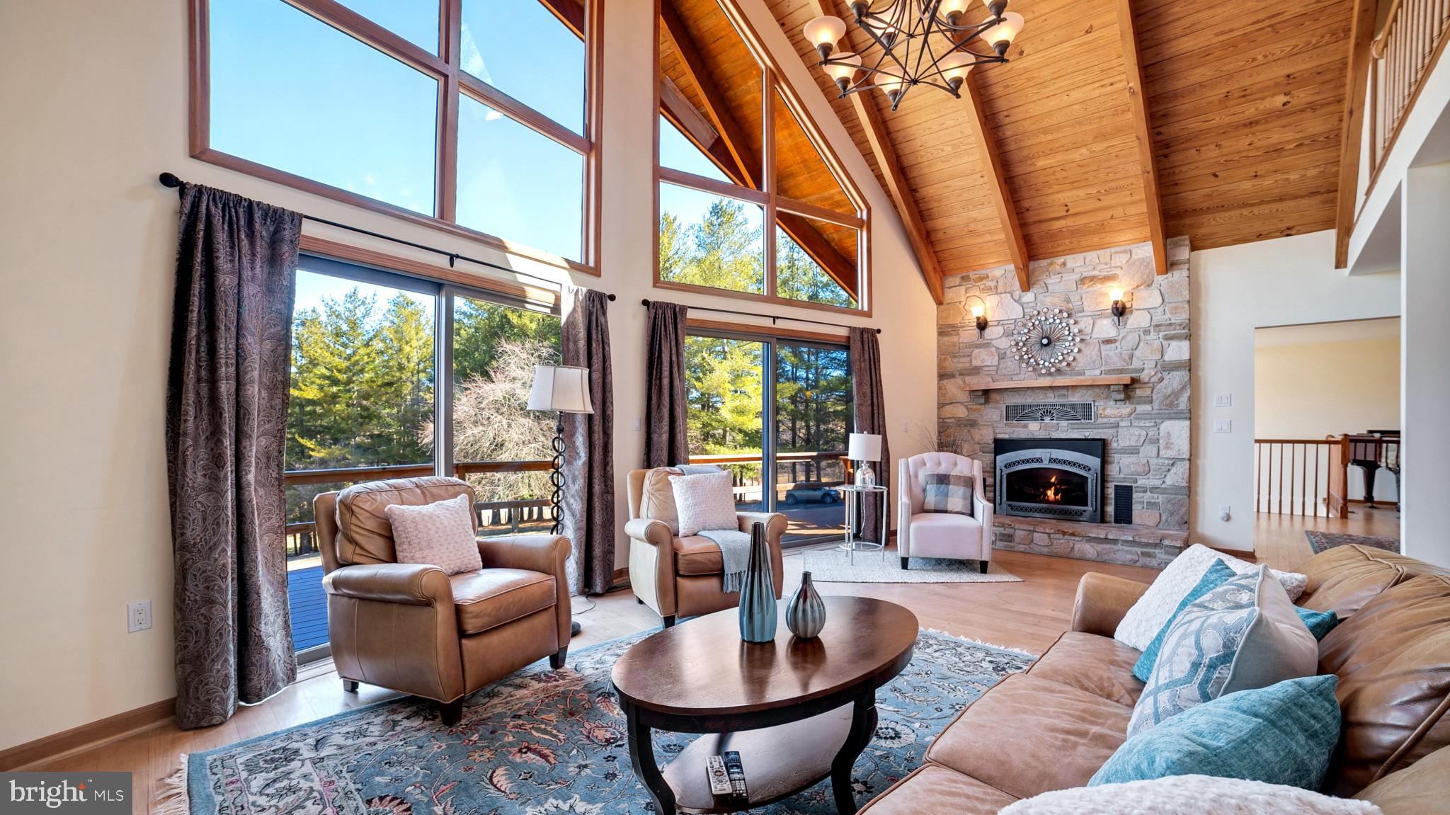 4757 Buffalo Road Mount Airy, MD 21771 - Photo 5 of 50 a living room with furniture a fireplace and a large window