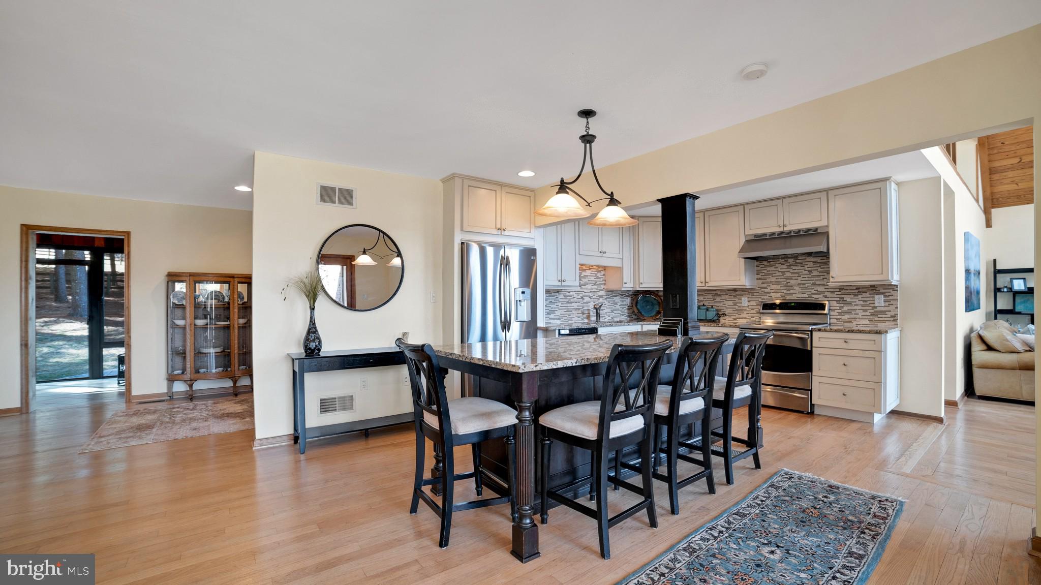 4757 Buffalo Road Mount Airy, MD 21771 - Photo 7 of 50 a view of a dining room with furniture and wooden floor