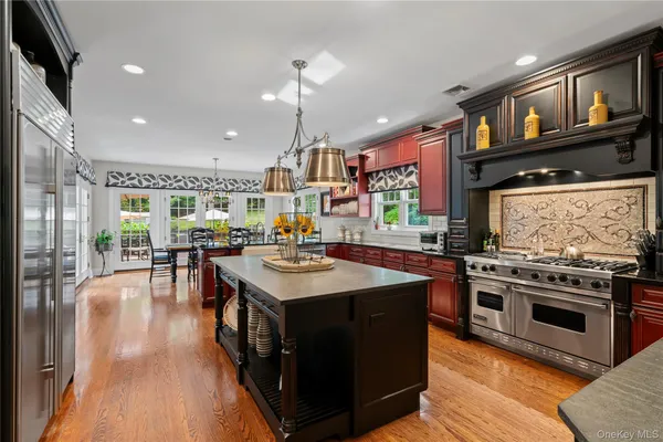 a kitchen with a stove and cabinets