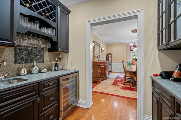 a hallway with a stove and a wooden floor