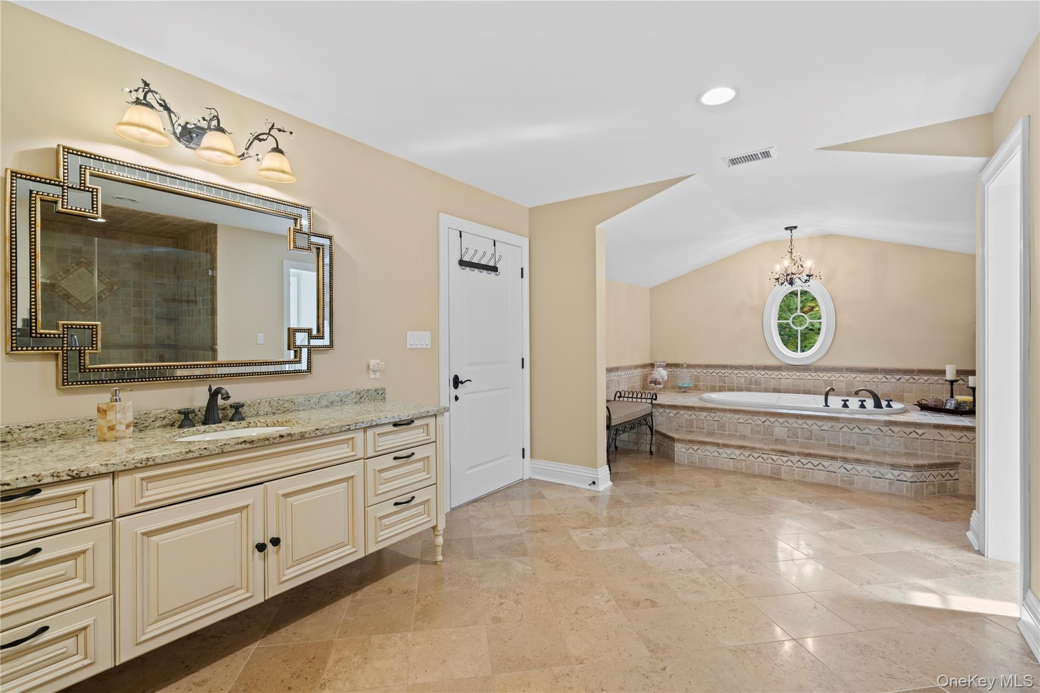 12 Parish Drive Locust Valley, NY 11560 - Photo 29 of 49 a spacious bathroom with double vanity and a mirror