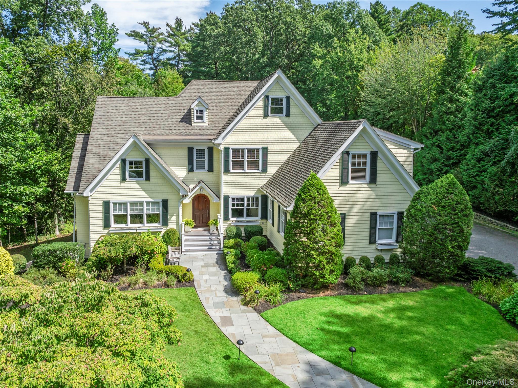 12 Parish Drive Locust Valley, NY 11560 - Photo 37 of 49 a front view of a house with garden