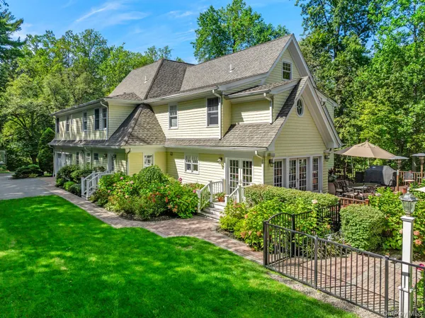 a front view of house with yard and green space