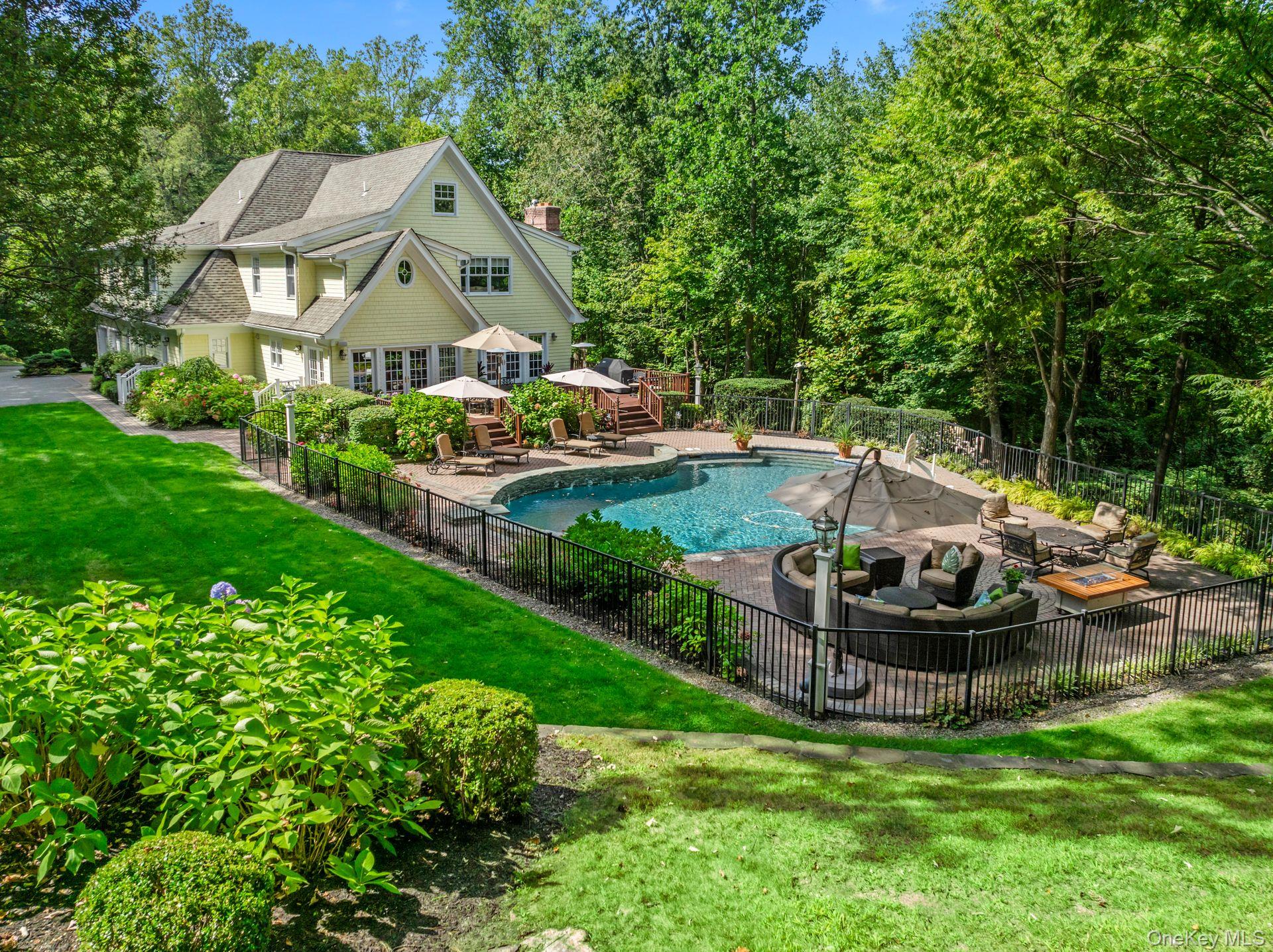 12 Parish Drive Locust Valley, NY 11560 - Photo 6 of 49 a front view of a house with garden