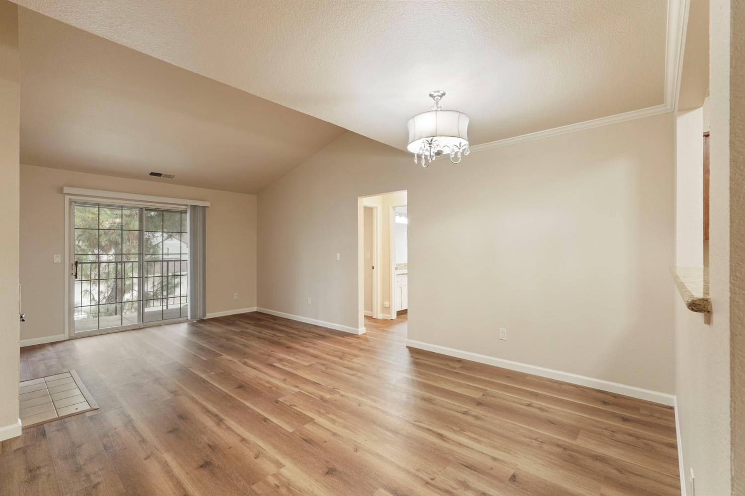 2400 Eilers Lane, Unit 1806 Lodi, CA 95242 - Photo 13 of 29 an empty room with wooden floor and windows