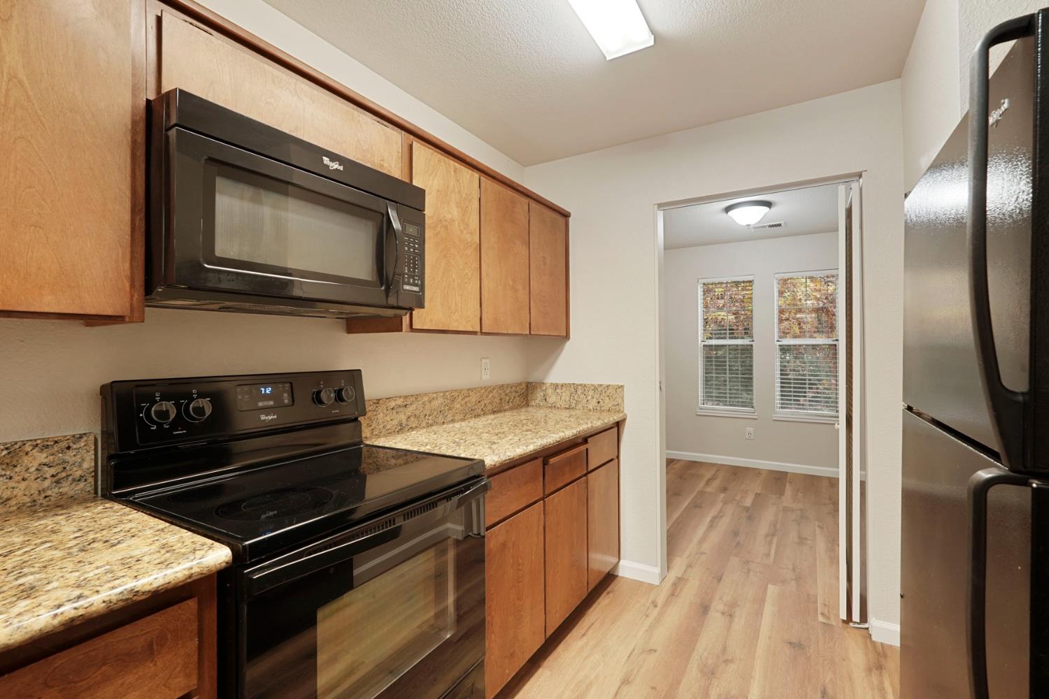 2400 Eilers Lane, Unit 1806 Lodi, CA 95242 - Photo 15 of 29 a kitchen with a stove microwave and sink