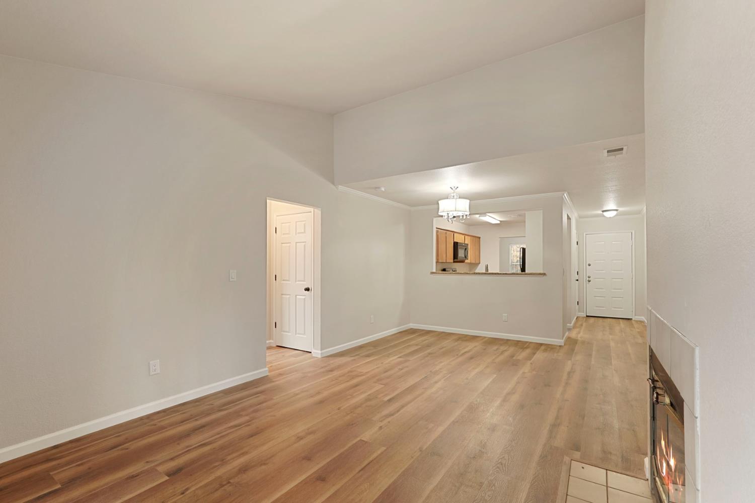 2400 Eilers Lane, Unit 1806 Lodi, CA 95242 - Photo 5 of 29 an empty room with wooden floor and windows