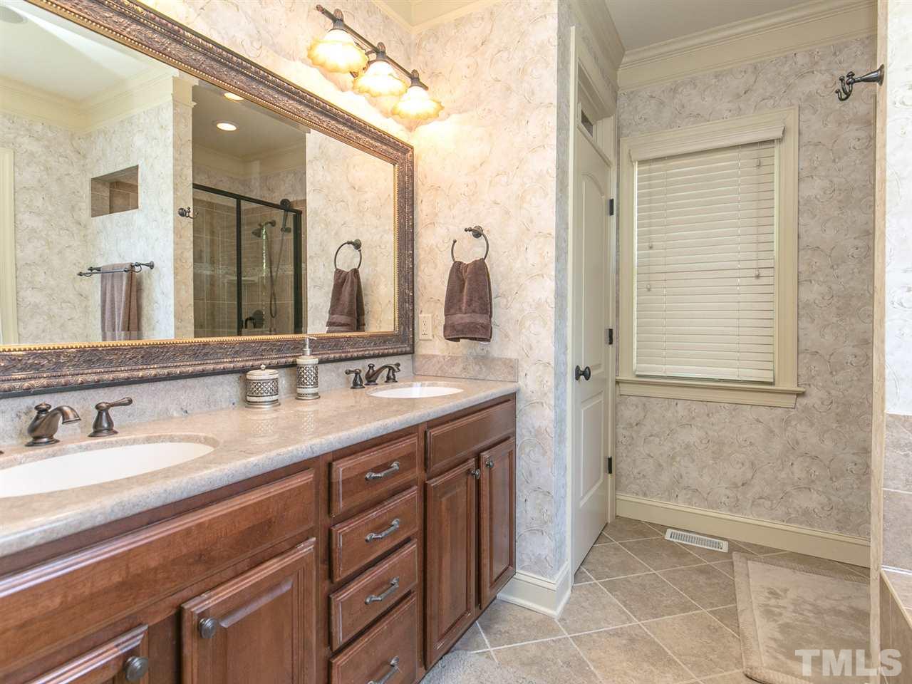 12609 Port Chester Court Raleigh, NC 27614 - Photo 12 of 23 Dual Sink Vanity and Tile Flooring