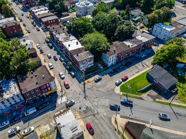 an aerial view of a house with a yard