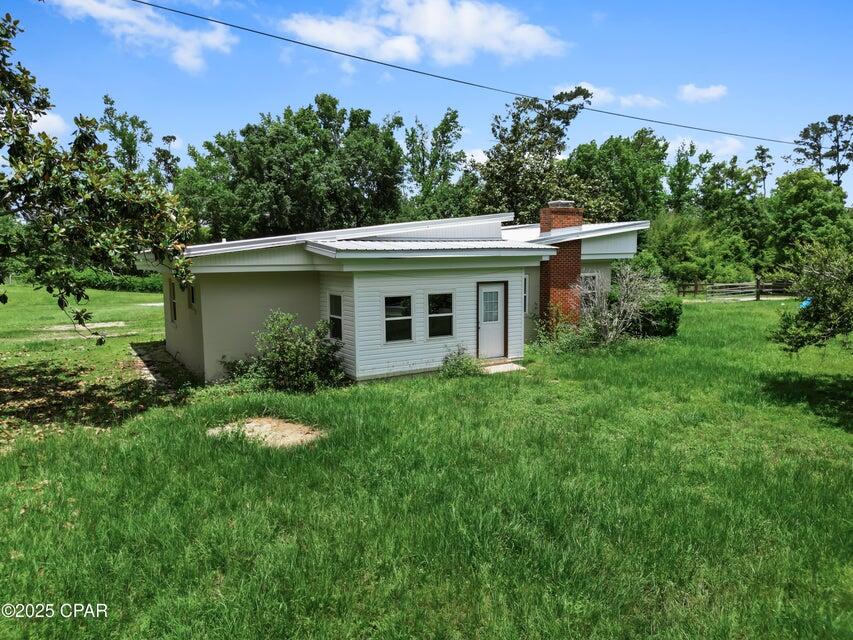 133 Devane Road Chattahoochee, FL 32324 - Photo 11 of 39 a view of a house with a backyard