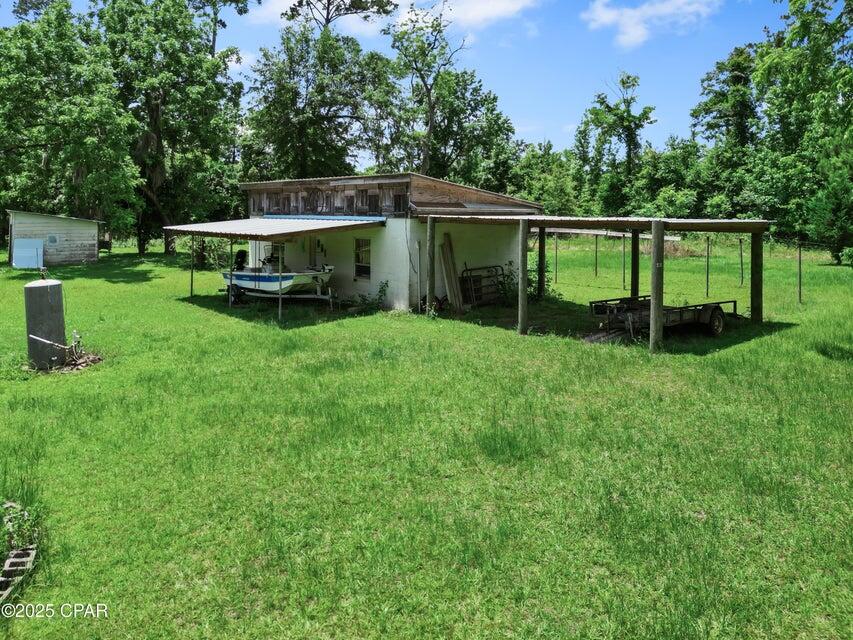 133 Devane Road Chattahoochee, FL 32324 - Photo 14 of 39 a view of a deck with a big yard
