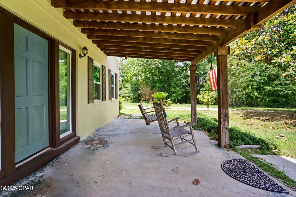 133 Devane Road Chattahoochee, FL 32324 - Photo 17 of 39 a view of a patio with a table chairs and a backyard