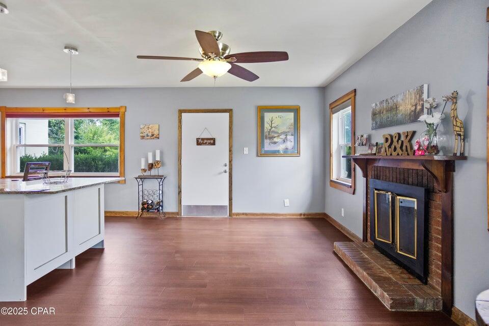 133 Devane Road Chattahoochee, FL 32324 - Photo 21 of 39 a living room with furniture and a fireplace