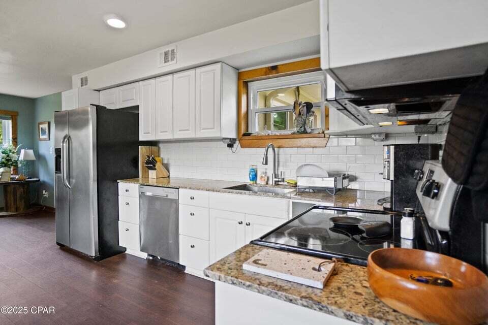 133 Devane Road Chattahoochee, FL 32324 - Photo 22 of 39 a kitchen with a refrigerator and a sink