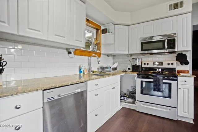 a work room with furniture and a window