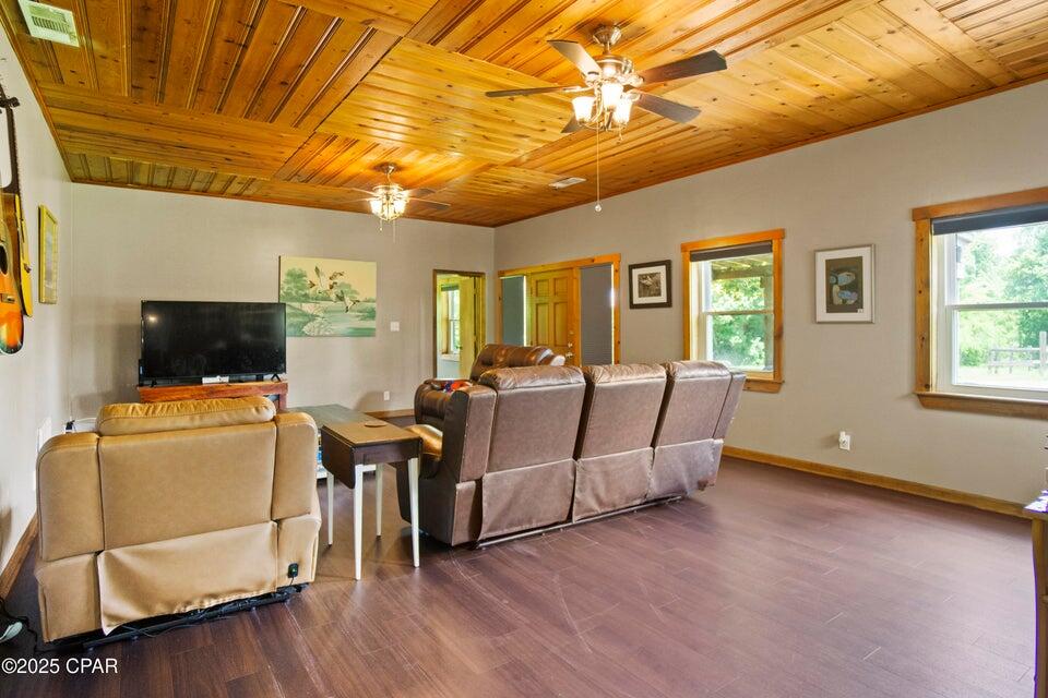 133 Devane Road Chattahoochee, FL 32324 - Photo 26 of 39 a living room with furniture and a flat screen tv