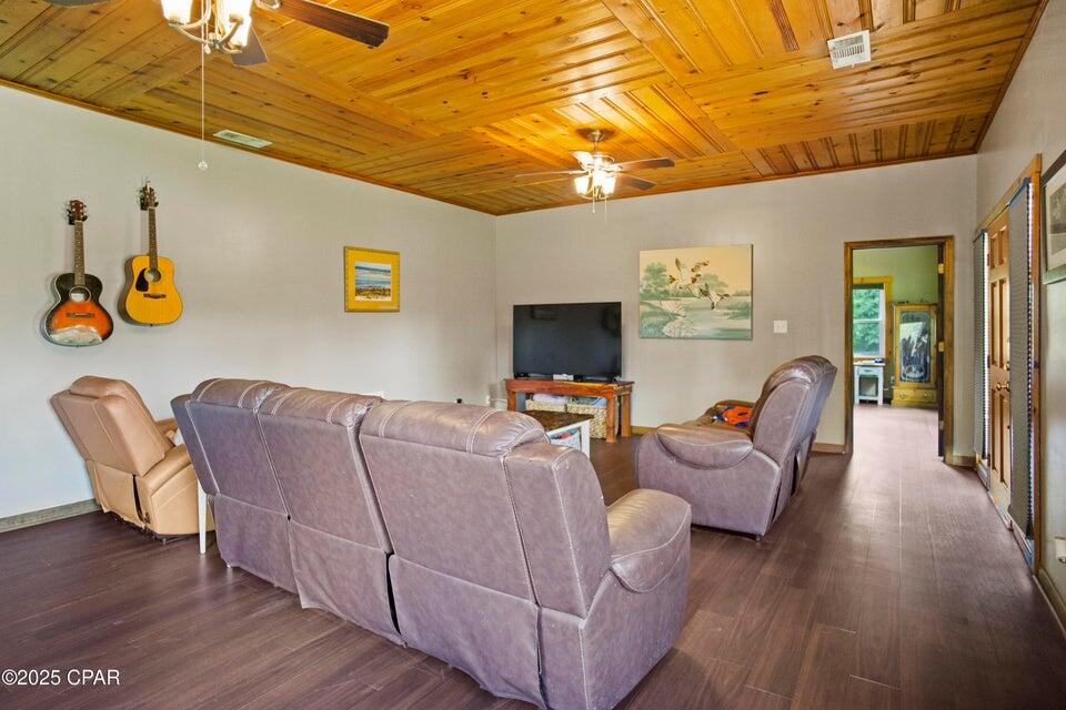 133 Devane Road Chattahoochee, FL 32324 - Photo 27 of 39 a living room with furniture and a flat screen tv