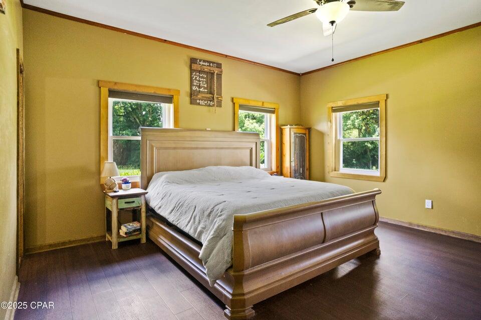 133 Devane Road Chattahoochee, FL 32324 - Photo 33 of 39 a bed sitting in a bedroom next to a window