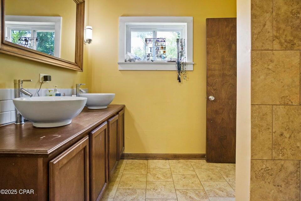 133 Devane Road Chattahoochee, FL 32324 - Photo 37 of 39 a bathroom with a sink and a mirror