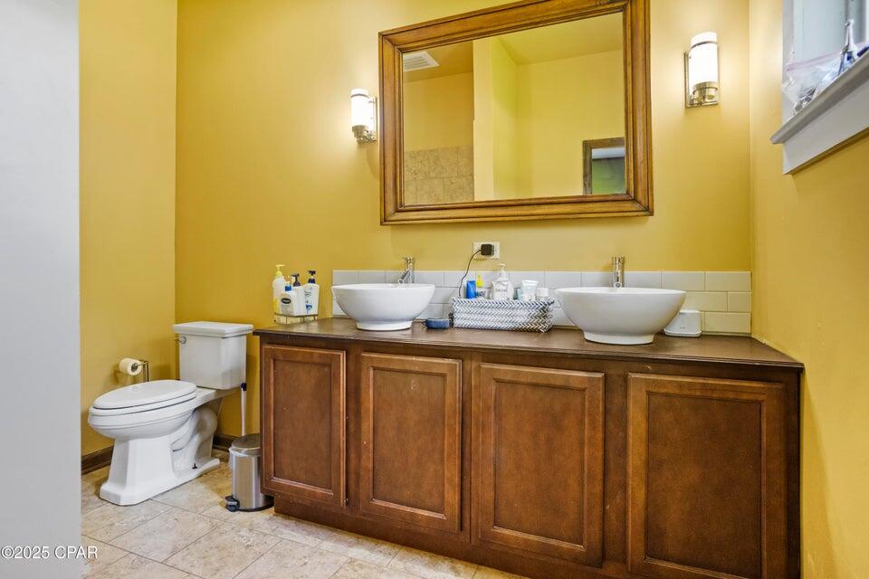 133 Devane Road Chattahoochee, FL 32324 - Photo 38 of 39 a bathroom with a toilet sink and mirror