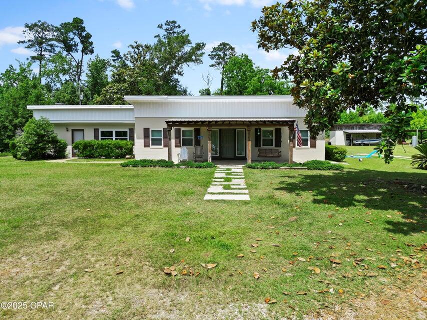 133 Devane Road Chattahoochee, FL 32324 - Photo 7 of 39 a view of a house with a yard