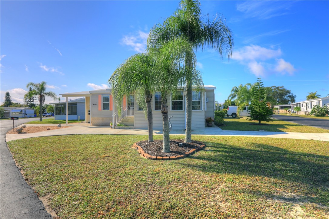 9755 61st Terrace Sebastian, FL 32958 - Photo 1 of 35 a swimming pool with outdoor seating and yard