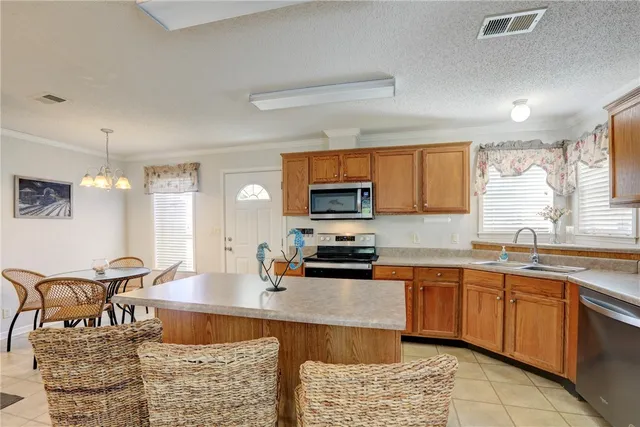 a large kitchen with a table and chairs in it