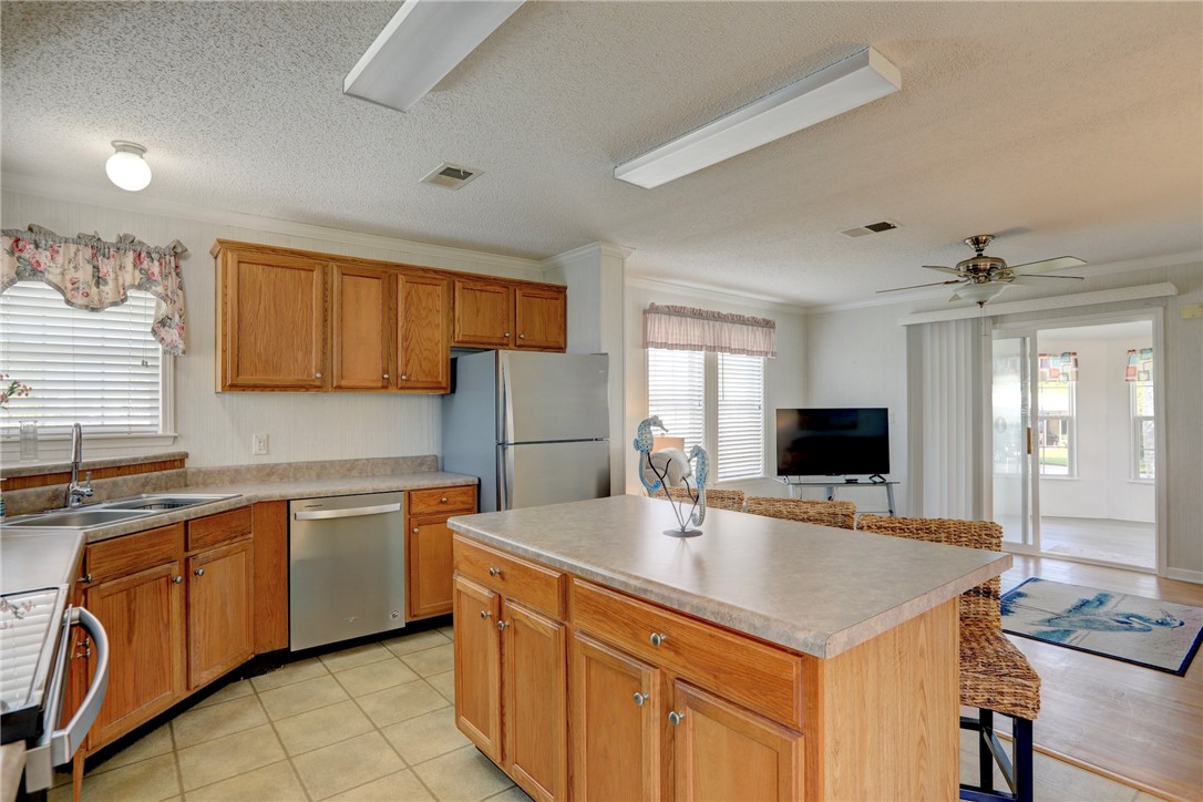 9755 61st Terrace Sebastian, FL 32958 - Photo 14 of 35 a kitchen with a sink cabinets and wooden floor