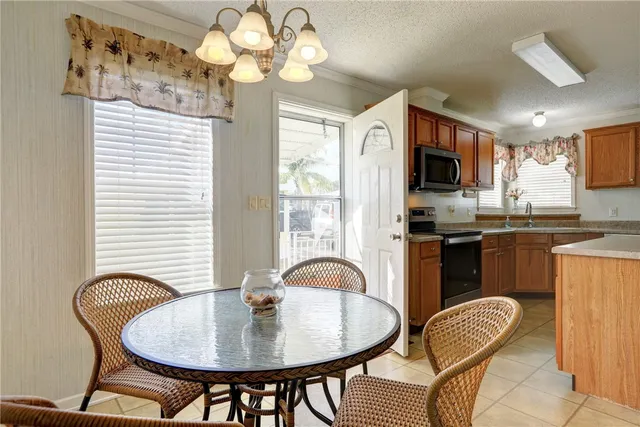 a dining room with furniture and chandelier