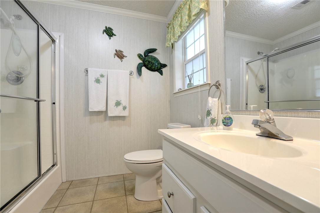 9755 61st Terrace Sebastian, FL 32958 - Photo 23 of 35 a bathroom with a sink toilet and shower