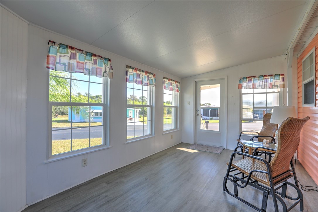9755 61st Terrace Sebastian, FL 32958 - Photo 29 of 35 a living room with furniture and a large window