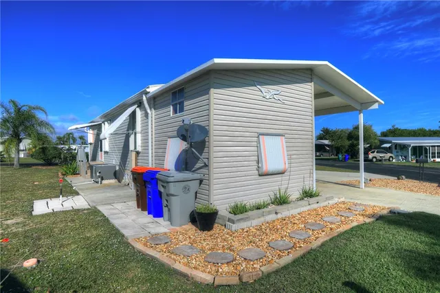a front view of house with yard and outdoor seating