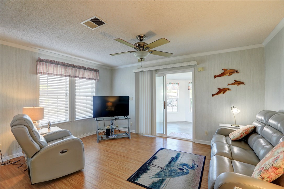 9755 61st Terrace Sebastian, FL 32958 - Photo 10 of 35 a living room with furniture and a flat screen tv