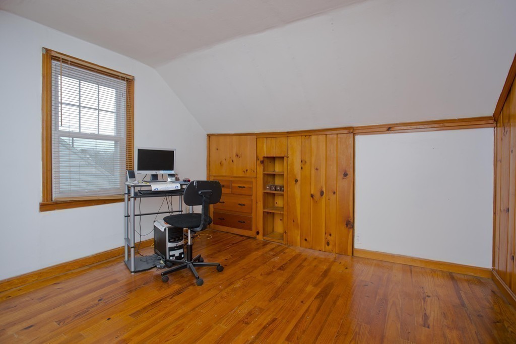 14 French Street Springfield, MA 01104 - Photo 19 of 29 a view of a workspace with furniture and a window