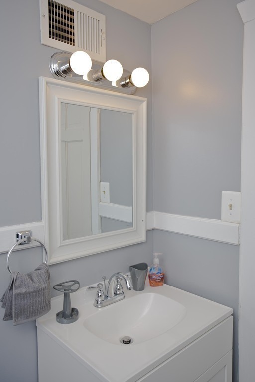 14 French Street Springfield, MA 01104 - Photo 22 of 29 a bathroom with a sink vanity and a mirror