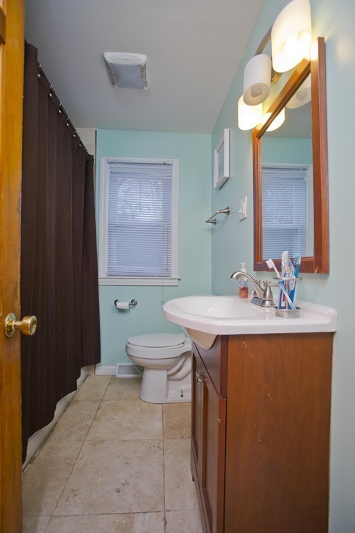 14 French Street Springfield, MA 01104 - Photo 26 of 29 a bathroom with a sink a toilet and mirror