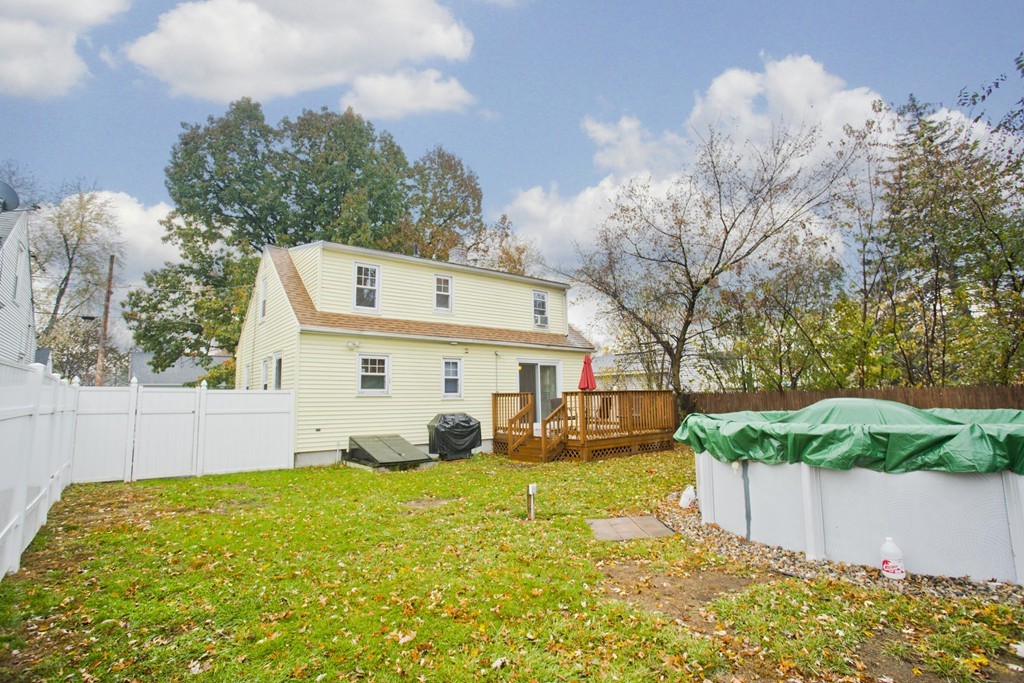 14 French Street Springfield, MA 01104 - Photo 7 of 29 a view of a white house with a big yard and large tree