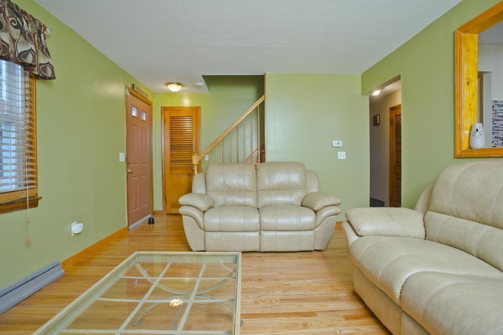 14 French Street Springfield, MA 01104 - Photo 9 of 29 a living room with a couch and a rug