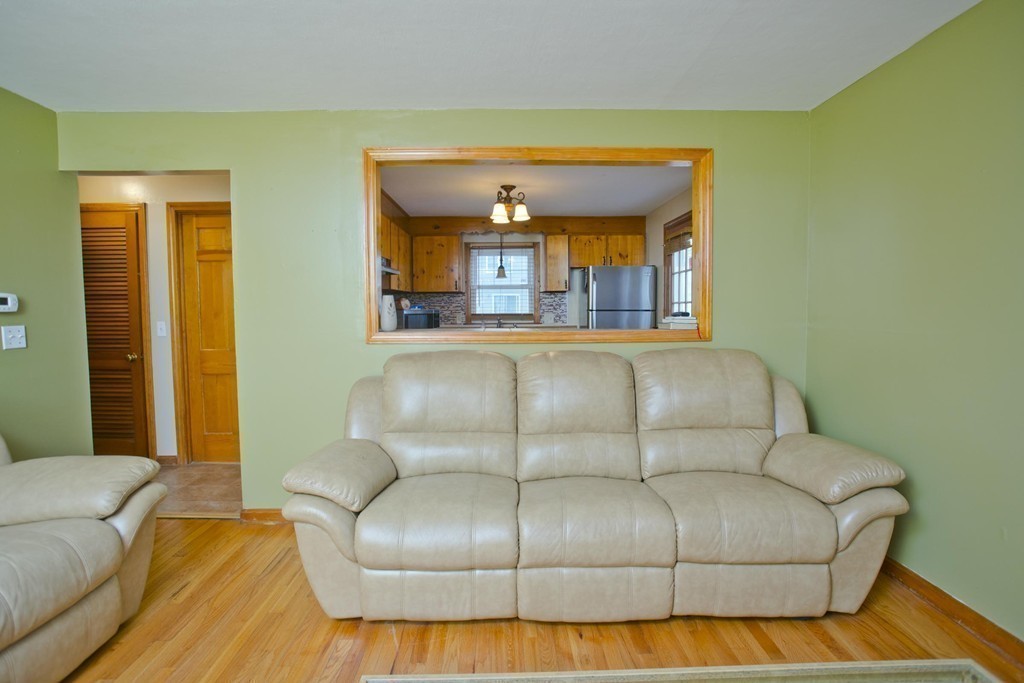 14 French Street Springfield, MA 01104 - Photo 10 of 29 a living room with a couch and a dining table