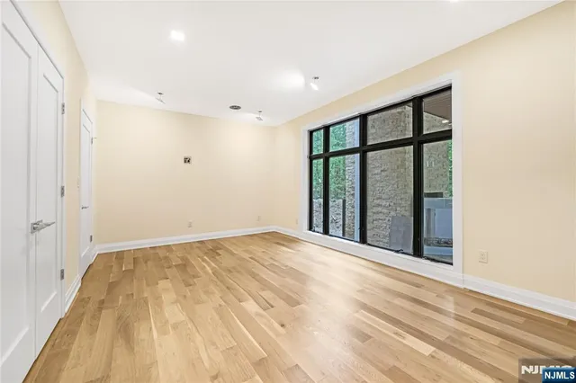 a bathroom with a sink toilet vanity and shower