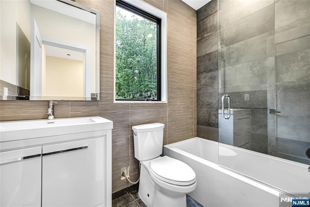 10 Big Ramapo Road Saddle River, NJ 07458 - Photo 23 of 44 a bathroom with a sink toilet and shower