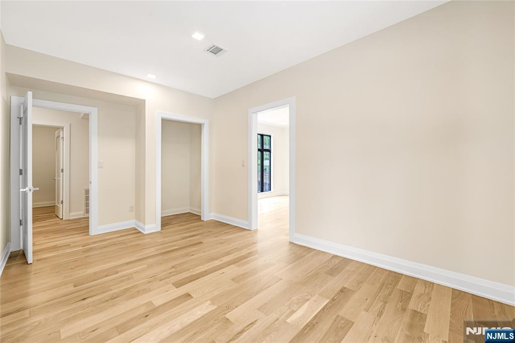 10 Big Ramapo Road Saddle River, NJ 07458 - Photo 35 of 44 a view of an empty room with wooden floor