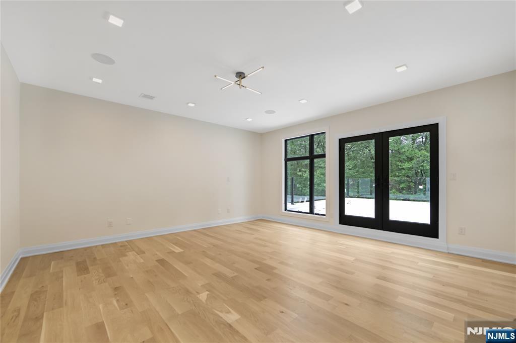 10 Big Ramapo Road Saddle River, NJ 07458 - Photo 36 of 44 a view of an empty room with a window