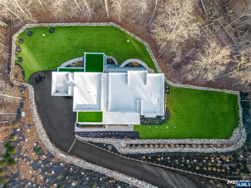 10 Big Ramapo Road Saddle River, NJ 07458 - Photo 4 of 44 a view of a back yard of the house